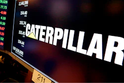 The logo for Caterpillar appears above a trading post on the floor of the New York Stock Exchange, April 23, 2018.