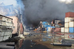 Containers burn, Sunday, April 27, 2025, after a massive explosion and fire rocked a port near the southern port city of Bandar Abbas, Iran, on Saturday.