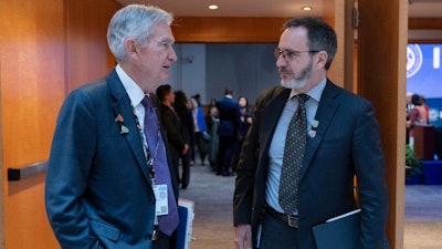 Federal Reserve Board Chairman Jerome Powell, left, speaks with IMF Economic Counsellor and Research Department Director Pierre-Olivier Gourinchas at International Monetary Fund headquarters, Washington, April 25, 2025.