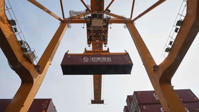 Cranes work on stacks of containers at the Bangkok Port in Bangkok, Thailand, April 10, 2025.