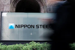 A person walks past a Nippon Steel Corporation sign at the company headquarters on Jan. 7, 2025, in Tokyo.