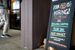 A hiring sign is displayed at a grocery store in Glenview, Ill., Monday, Nov. 25, 2024.