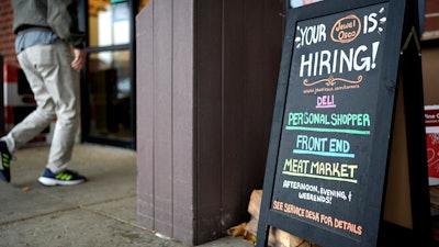 A hiring sign is displayed at a grocery store in Glenview, Ill., Monday, Nov. 25, 2024.