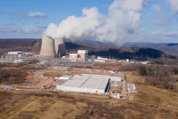 A data center owned by Amazon Web Services, front right, is under construction next to the Susquehanna nuclear power plant in Berwick, Pa., on Tuesday, Jan. 14, 2024.