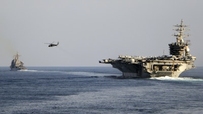 The aircraft carrier USS Dwight D. Eisenhower and other warships cross the Strait of Hormuz, Nov. 26, 2023.