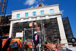 President Trump walks down stairs as he visits the Federal Reserve during renovations, July 24, 2025, Washington.
