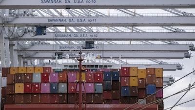 A vessel is loaded with containers at the Georgia Ports Authority's Port of Savannah Garden City Terminal, Oct. 21, 2021, Savannah, Ga.