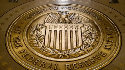 In a Feb. 5, 2018, file photo, the seal of the Board of Governors of the United States Federal Reserve System at the Marriner S. Eccles Federal Reserve Board Building, Washington.