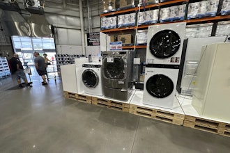 Washers stand on display near the entrance to a Costco warehouse Tuesday, July 8, 2025, in Sheridan, Colo.