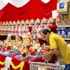 A worker stocks products at New India Bazar, Fremont, Calif., Aug. 6, 2025.