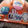 This is the back of the safety helmet worn by a steelworker listening to Pennsylvania Governor Josh Shapiro's meeting with media at the Clairton Coke Works, a U.S. Steel plant, in Clairton, Pa., Tuesday, Aug. 12, 2025.
