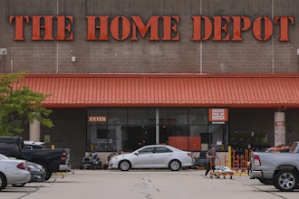 A shopper leaves a Home Depot store, Aug. 14, 2025, Manchester, N.H.