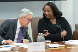 Federal Reserve Board of Governors member Lisa Cook, right, talks with Federal Reserve Chairman Jerome Powell, June 25, 2025, in Washington.