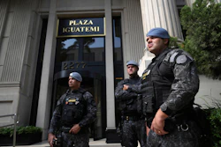 Police stand guard in front of a building in Sao Paulo, Aug. 28, 2025.