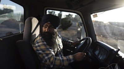 Prahb Singh maneuvers his truck at a gas station in Fontana, Calif., Sept. 3, 2025.