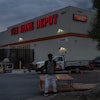 A day laborer waits for work in the parking lot of a Home Depot in the Van Nuys section of Los Angeles, Aug. 28, 2025.