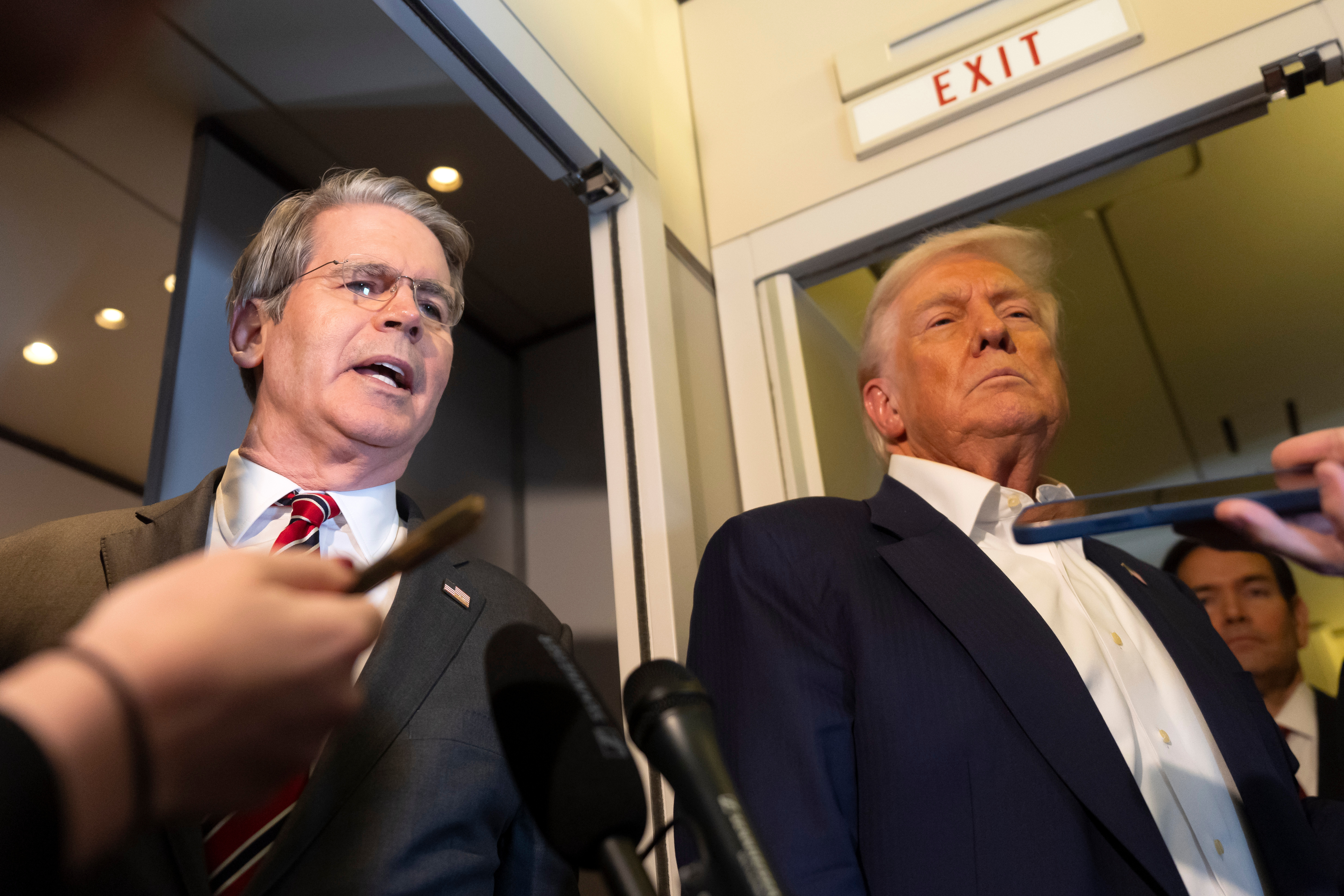 Treasury Secretary Scott Bessent, left, and President Donald Trump aboard Air Force One while traveling from Kuala Lumpur, Malaysia, to Tokyo, Oct. 27, 2025.