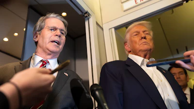 Treasury Secretary Scott Bessent, left, and President Donald Trump aboard Air Force One while traveling from Kuala Lumpur, Malaysia, to Tokyo, Oct. 27, 2025.
