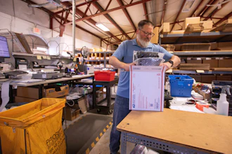 Terry Precision Cycling warehouse manager Luke Tremble packs orders at the company’s warehouse in Burlington, Vt., Oct. 28, 2025.