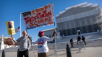 Protesters stand outside the Supreme Court, Nov. 5, 2025, Washington.