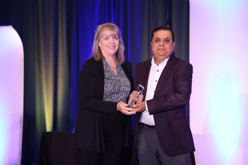 Ajay Bajaj of Rotator Products Limited receives the 2025 Warren Pike Award from PTDA EVP and CEO Ann Arnott during the PTDA Industry Summit, Oct. 24, 2025, San Antonio, Texas.