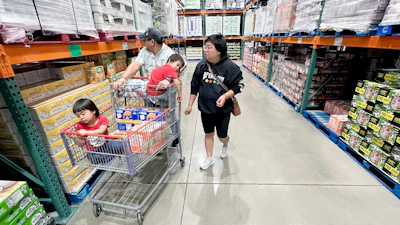 KC Neufeld, right, shops with her family in Englewood, Colo., Oct. 29, 2025.