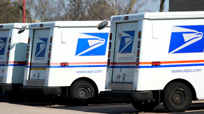 U.S. Postal Service trucks outside a post office, Jan. 29, 2024, Wheeling, Ill.