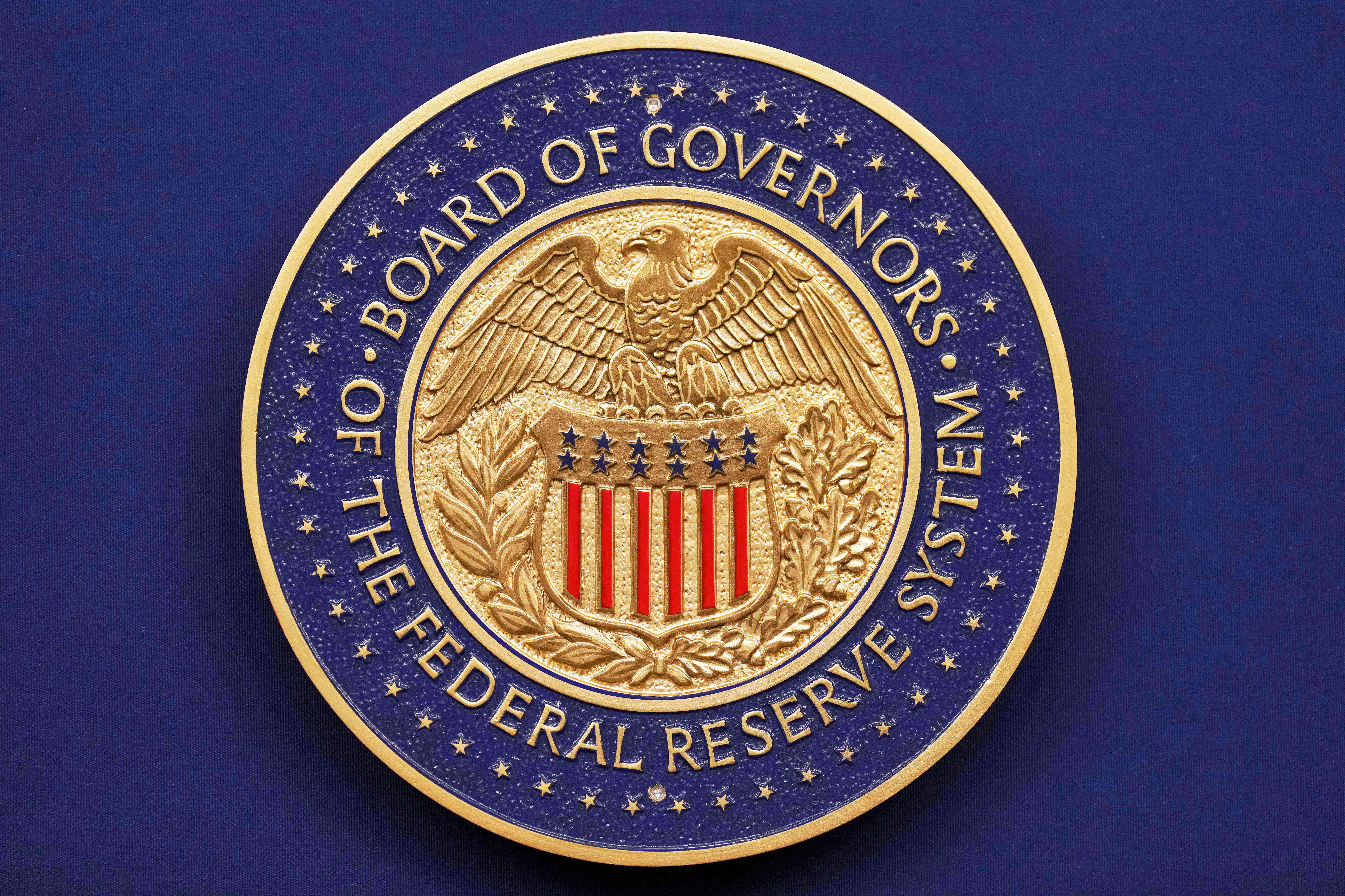 The Federal Reserve seal displayed during a news conference at the Federal Reserve Board Building in Washington, Sept. 17, 2025.