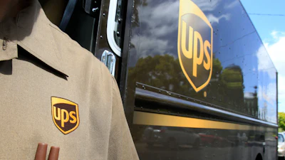 An April 25, 2011, file photo shows United Parcel Service driver Albert Palafox in Palo Alto, Calif.