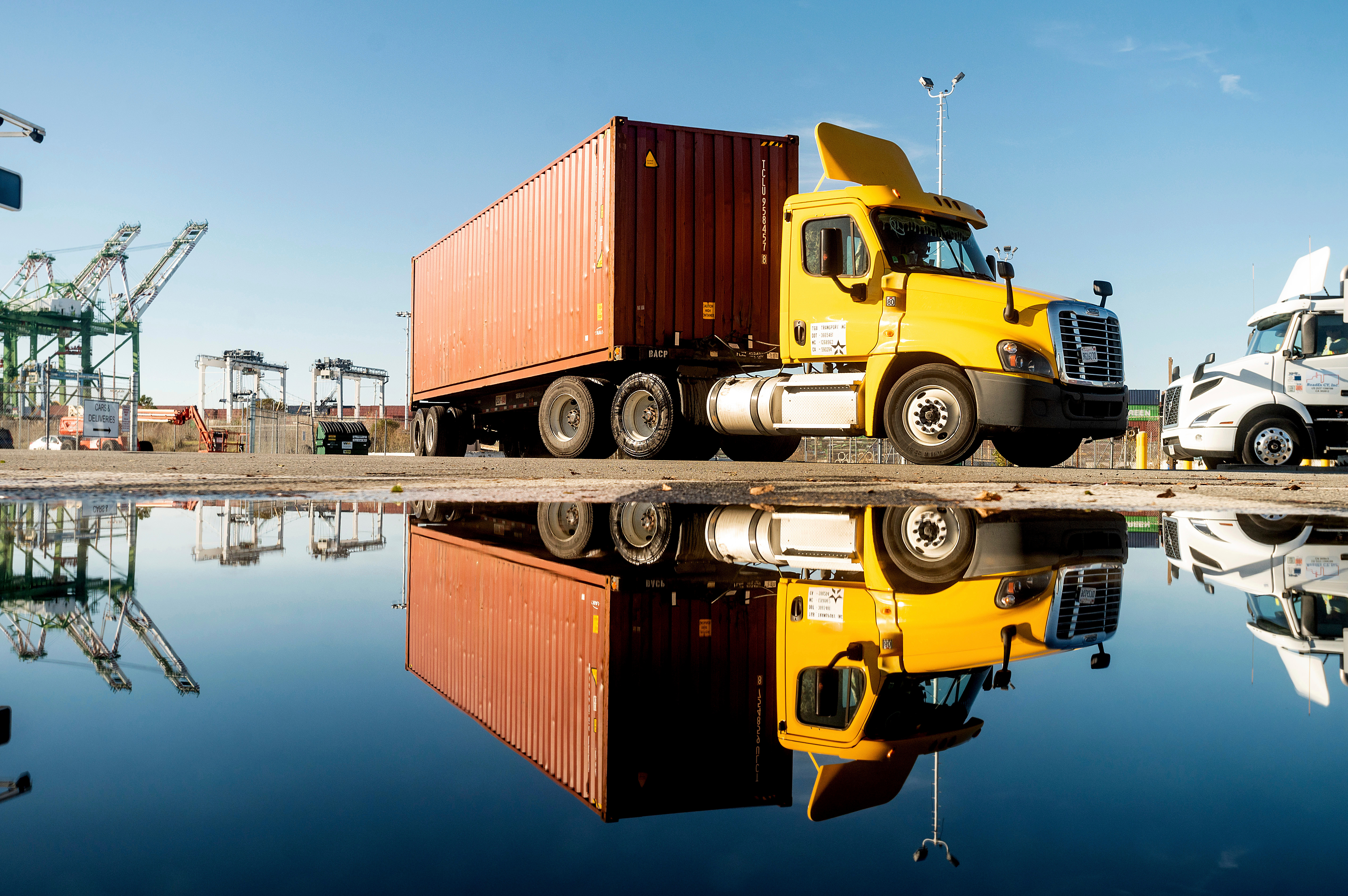 A truck departs from a Port of Oakland shipping terminal on Nov. 10, 2021, in Oakland, Calif.