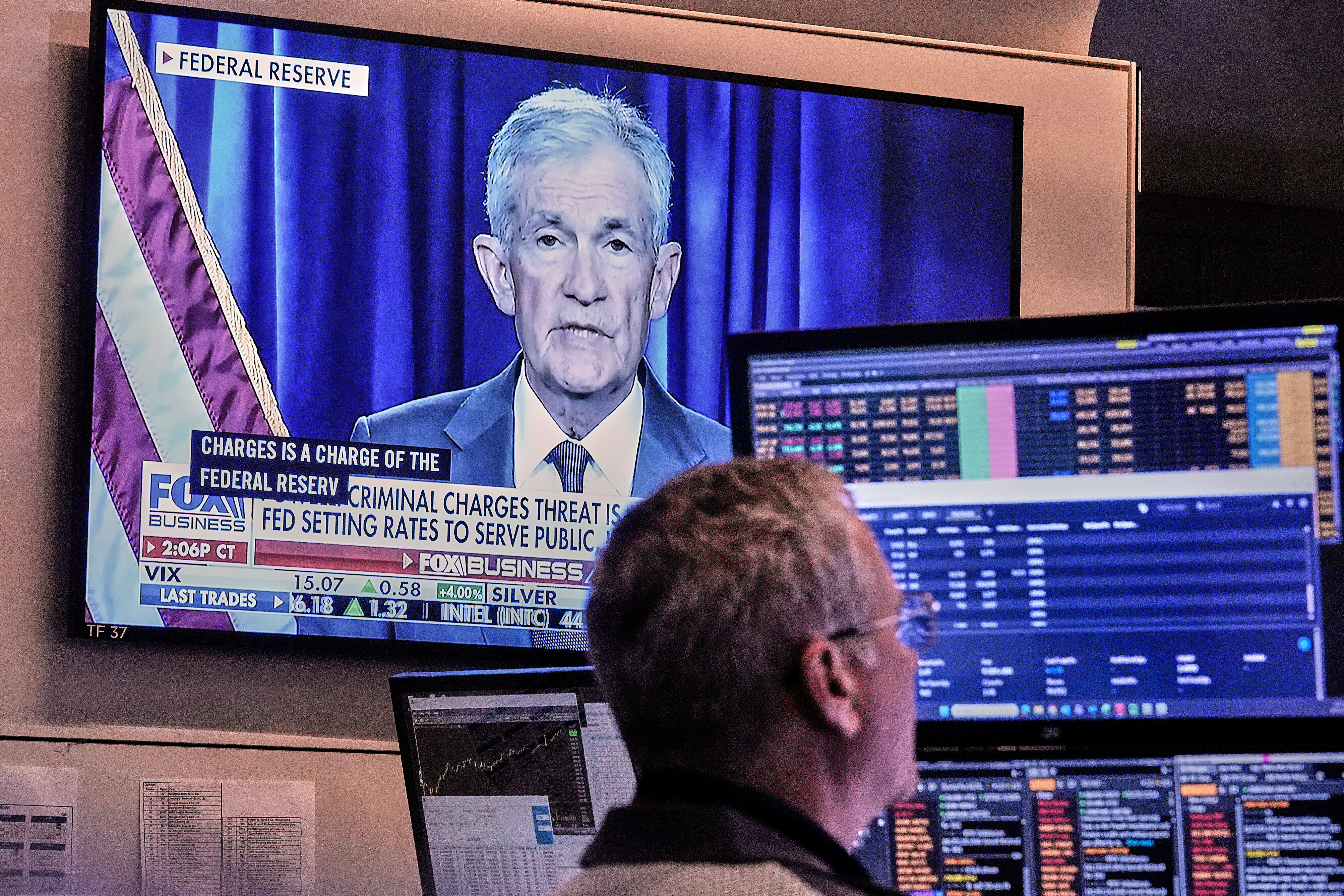 A video of Federal Reserve Chair Jerome Powell plays on a screen on the floor of the New York Stock Exchange, Jan. 12, 2026.