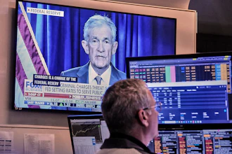 A video of Federal Reserve Chair Jerome Powell plays on a screen on the floor of the New York Stock Exchange, Jan. 12, 2026.