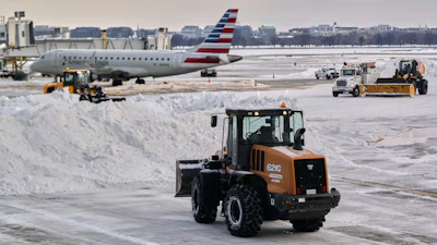 Snow and ice is cleared at Ronald Reagan Washington National Airport, Jan. 26, 2026, Arlington, Va.