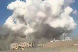 In this photo released by Xinhua News Agency, smoke rises from the site of explosions from a factory in Baotou, in north China's Inner Mongolia Autonomous Region, Sunday, Jan. 18, 2026.
