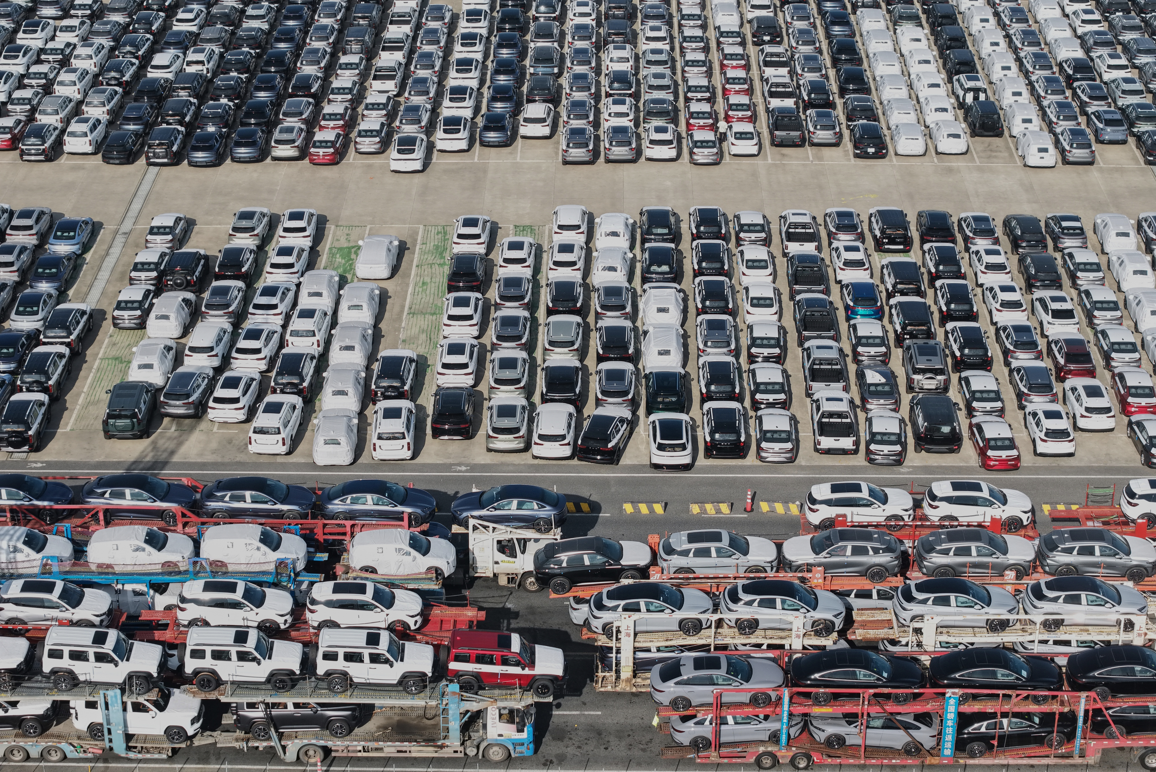 Aerial view of new cars waiting for shipment at a port in Shanghai, Jan. 14, 2026.