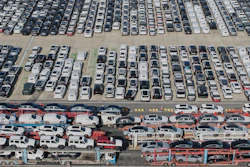 Aerial view of new cars waiting for shipment at a port in Shanghai, Jan. 14, 2026.