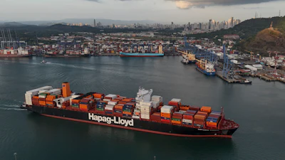 A cargo ship sails past the Panama Canal's Port of Balboa, managed by CK Hutchison Holdings, Panama City, March 13, 2025.