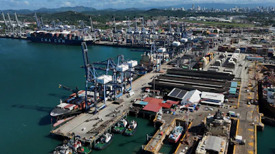 Cranes load a cargo ship at the Panama Canal's Port of Balboa, Panama City, Jan. 30, 2026.