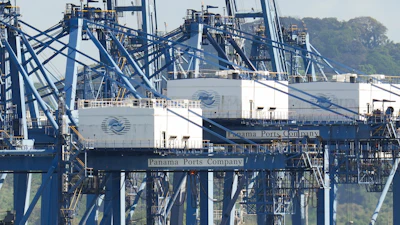 Cranes load a cargo ship at the Panama Canal's Port of Balboa, Jan. 30, 2026.