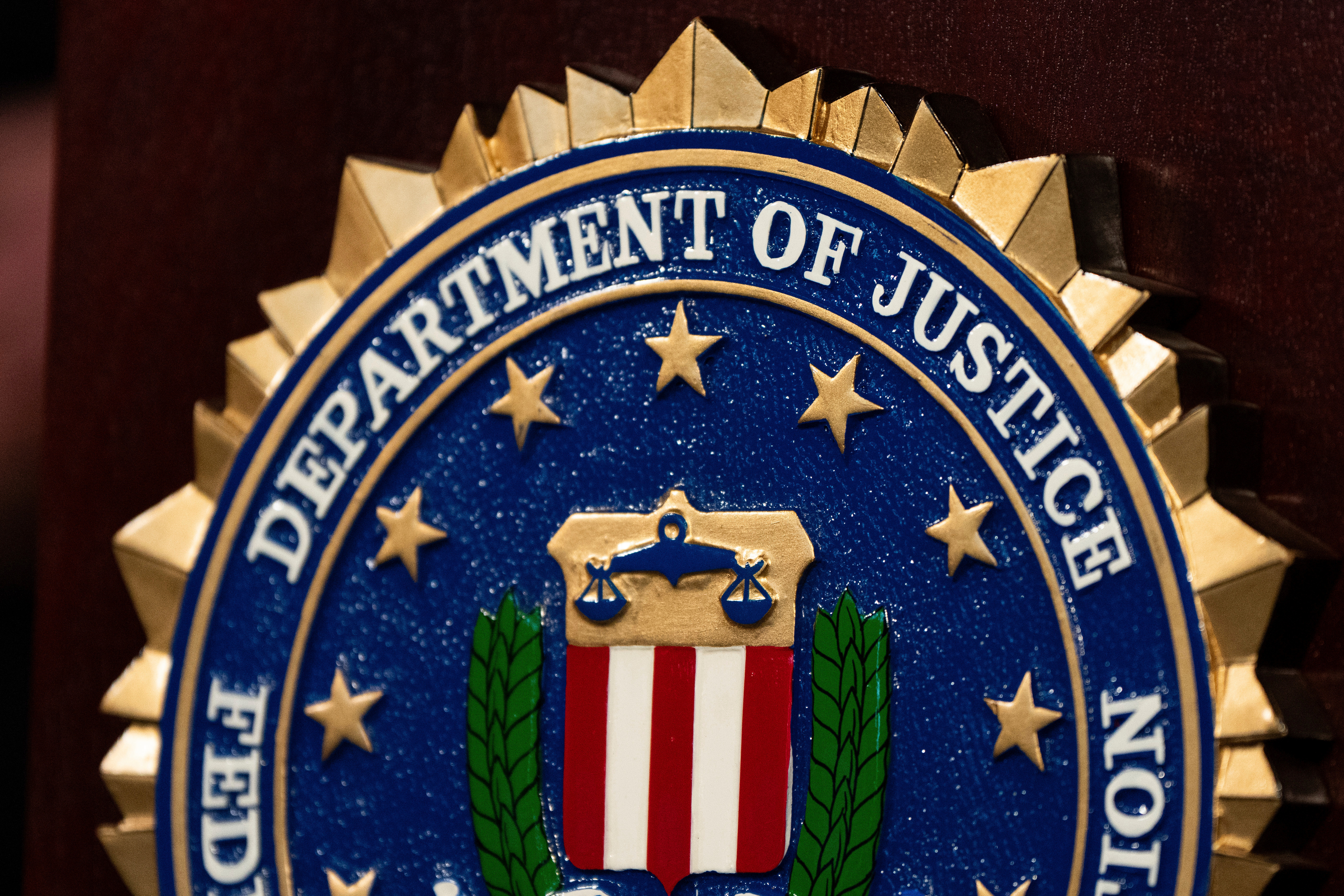 An FBI seal displayed on a podium before a news conference at the field office in Portland, Ore., Jan. 16, 2025.