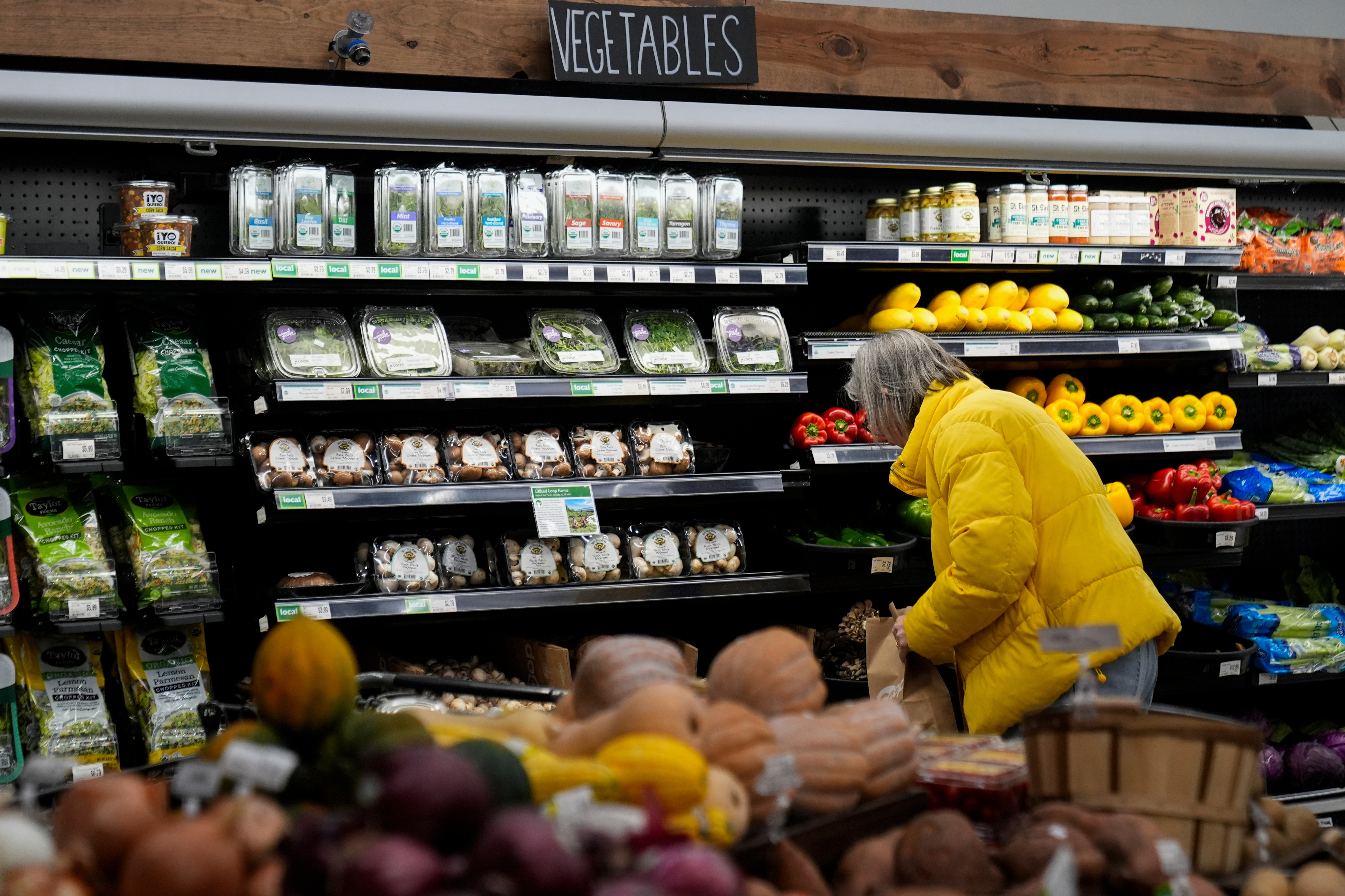 A shopper looks at produce at a grocery store in Chicago, Feb. 10, 2026.