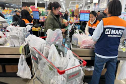 A shopper checks out at a grocery store in Schaumburg, Ill., Feb. 9, 2026.