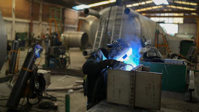 An employee welds metal at a steel tank factory in Mexico City, Feb. 11, 2025.