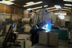 An employee welds metal at a steel tank factory in Mexico City, Feb. 11, 2025.