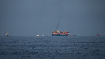 Oil tankers and cargo ships line up in the Strait of Hormuz as seen from Khor Fakkan, United Arab Emirates, March 11, 2026.