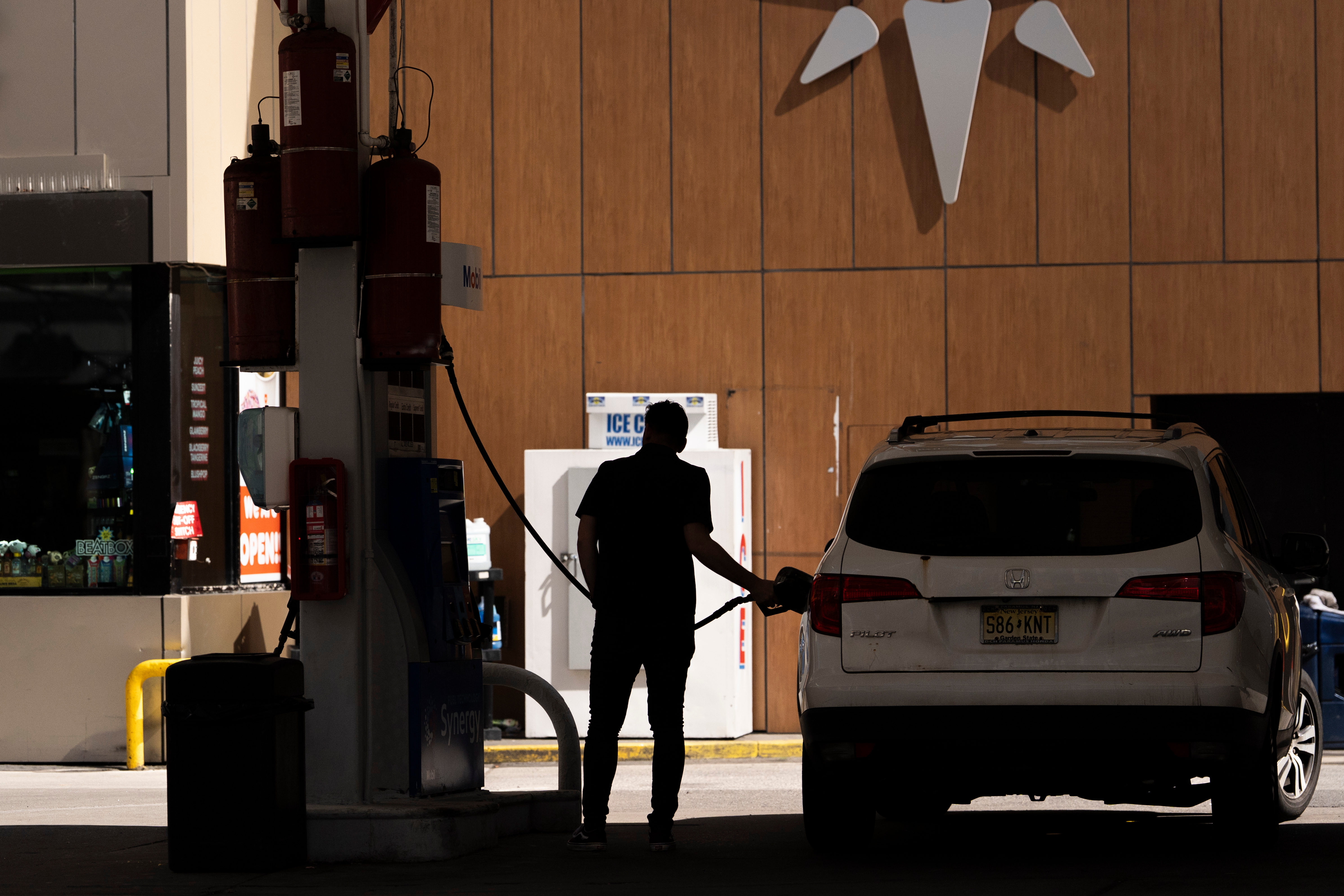 A person fuels up a vehicle at a gas station in New York, March 10, 2026.