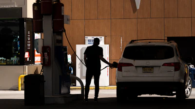 A person fuels up a vehicle at a gas station in New York, March 10, 2026.