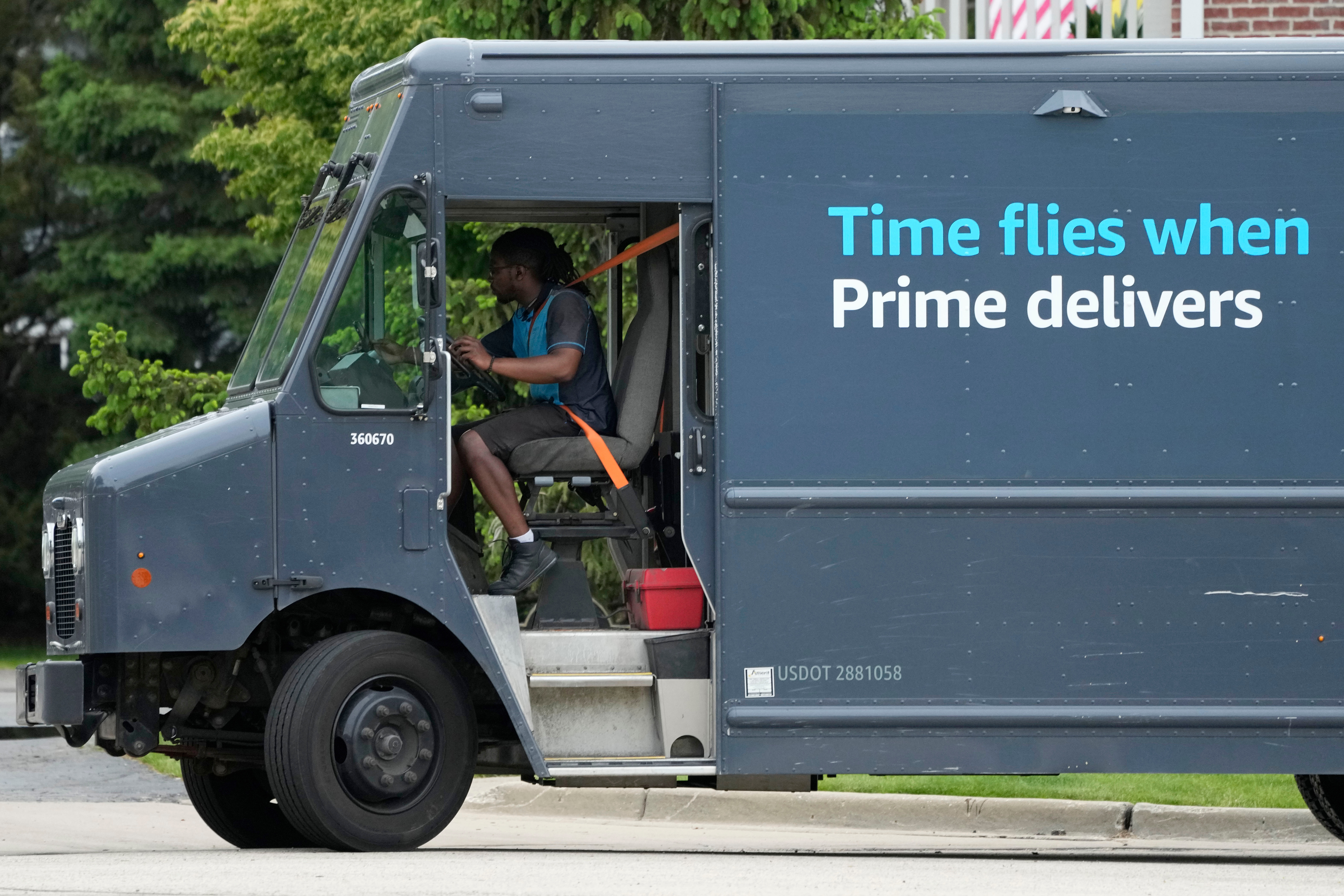 An Amazon truck makes deliveries in Wheeling, Ill., May 16, 2024.