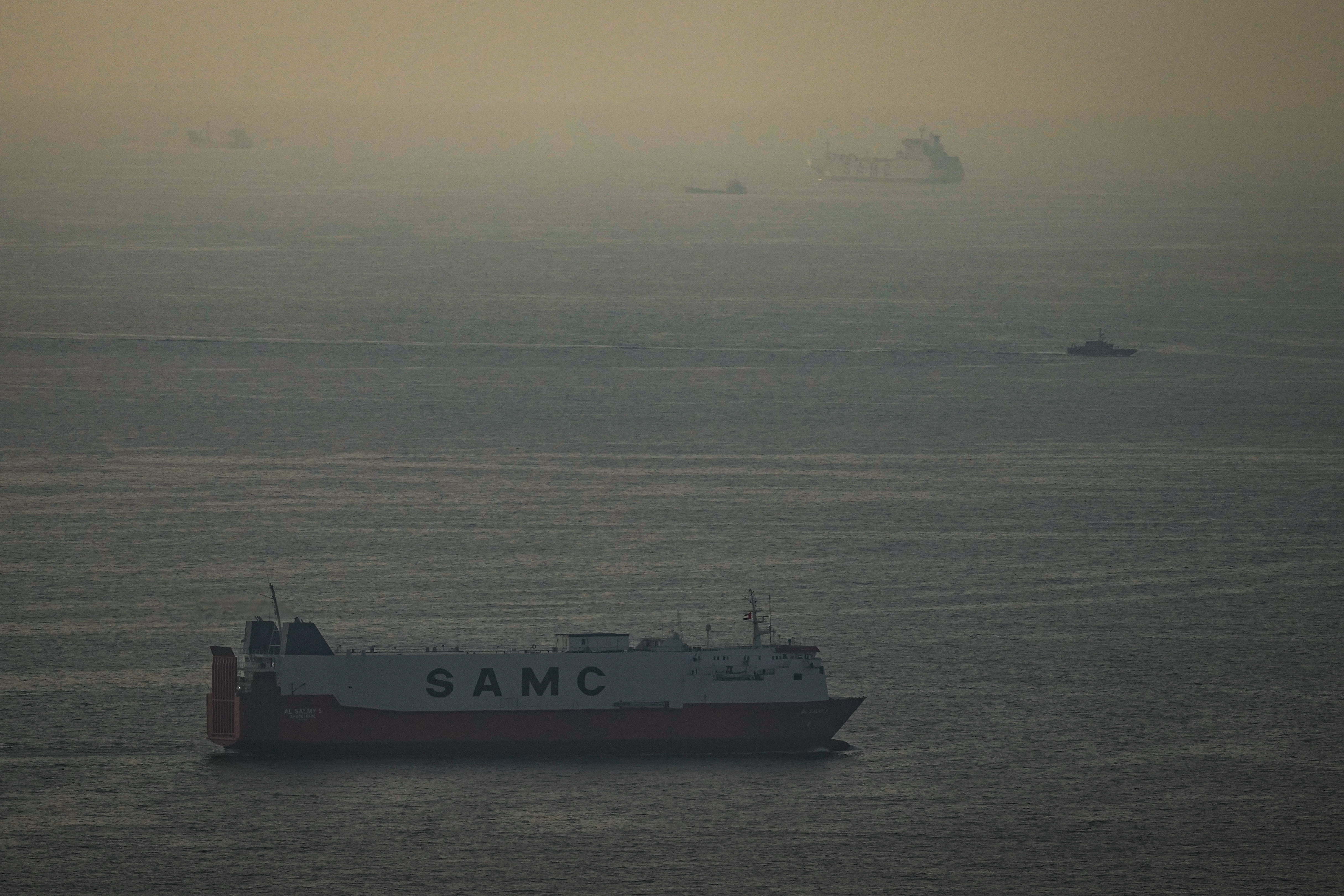 Cargo ships sail in the Arabian Gulf towards Strait of Hormuz in United Arab Emirates, March 19, 2026.