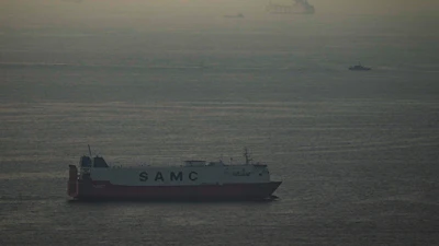 Cargo ships sail in the Arabian Gulf towards Strait of Hormuz in United Arab Emirates, March 19, 2026.